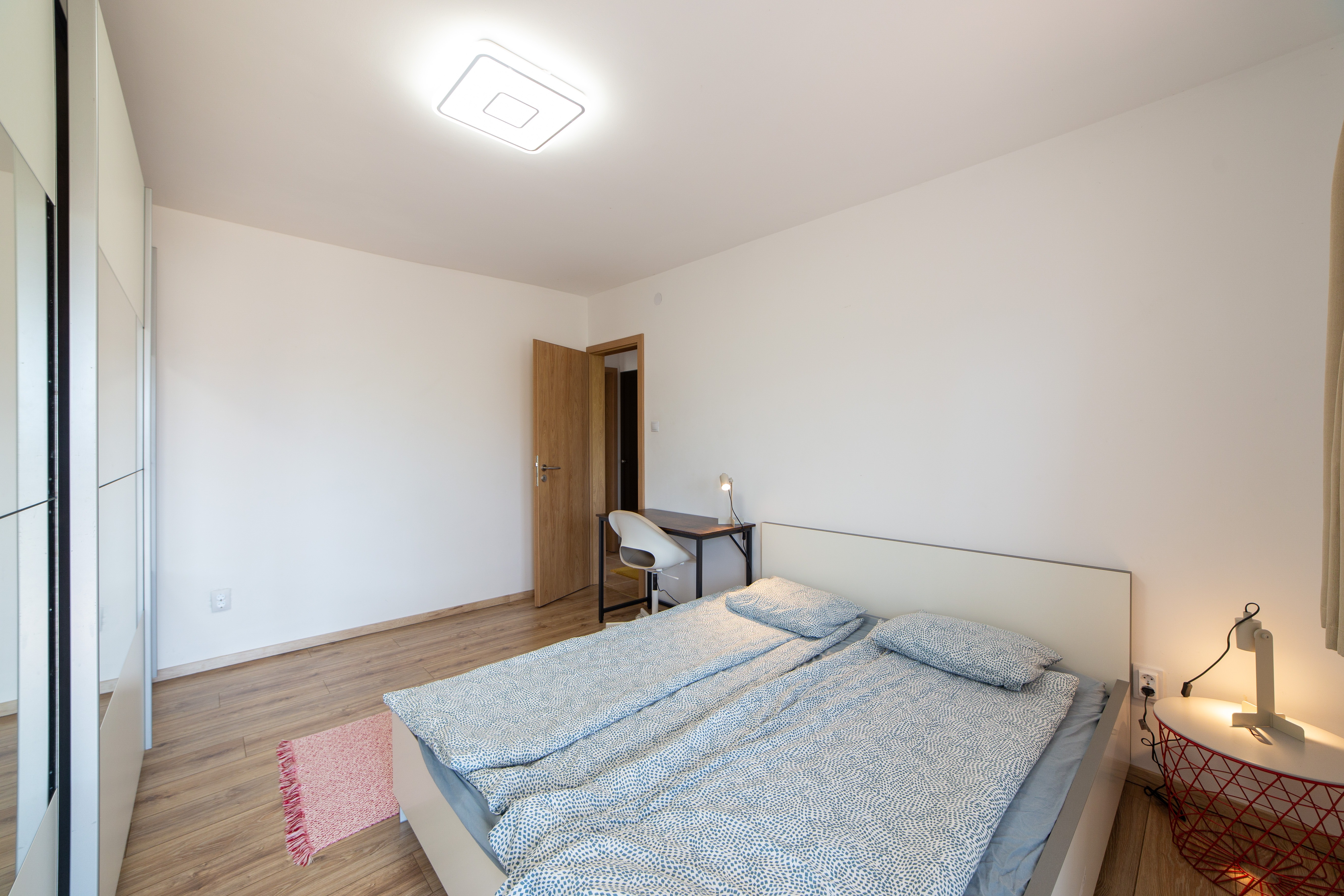 Bedroom 1 — double bed with wardrobe and desk