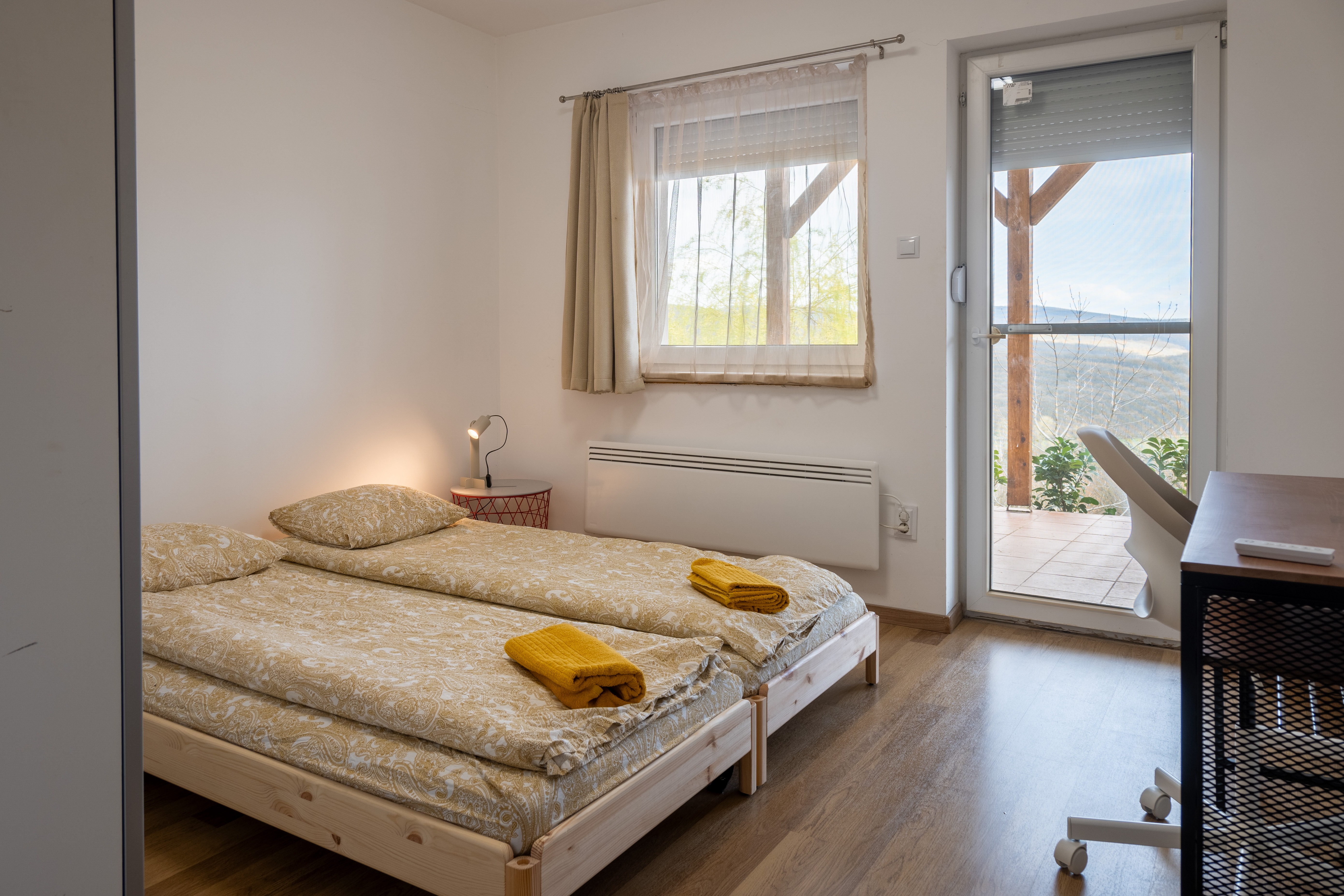 Bedroom 2 — twin beds with panoramic mountain view